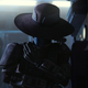 Cad Bane, shrouded by a hat, leans into a wall on animated Disney+ series Star Wars: The Bad Batch.